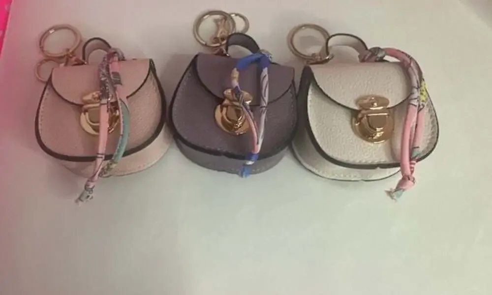 CHARM INFINITE Mini Saddle-Shaped Keychain Purse With Printed Scarf PU Leather T